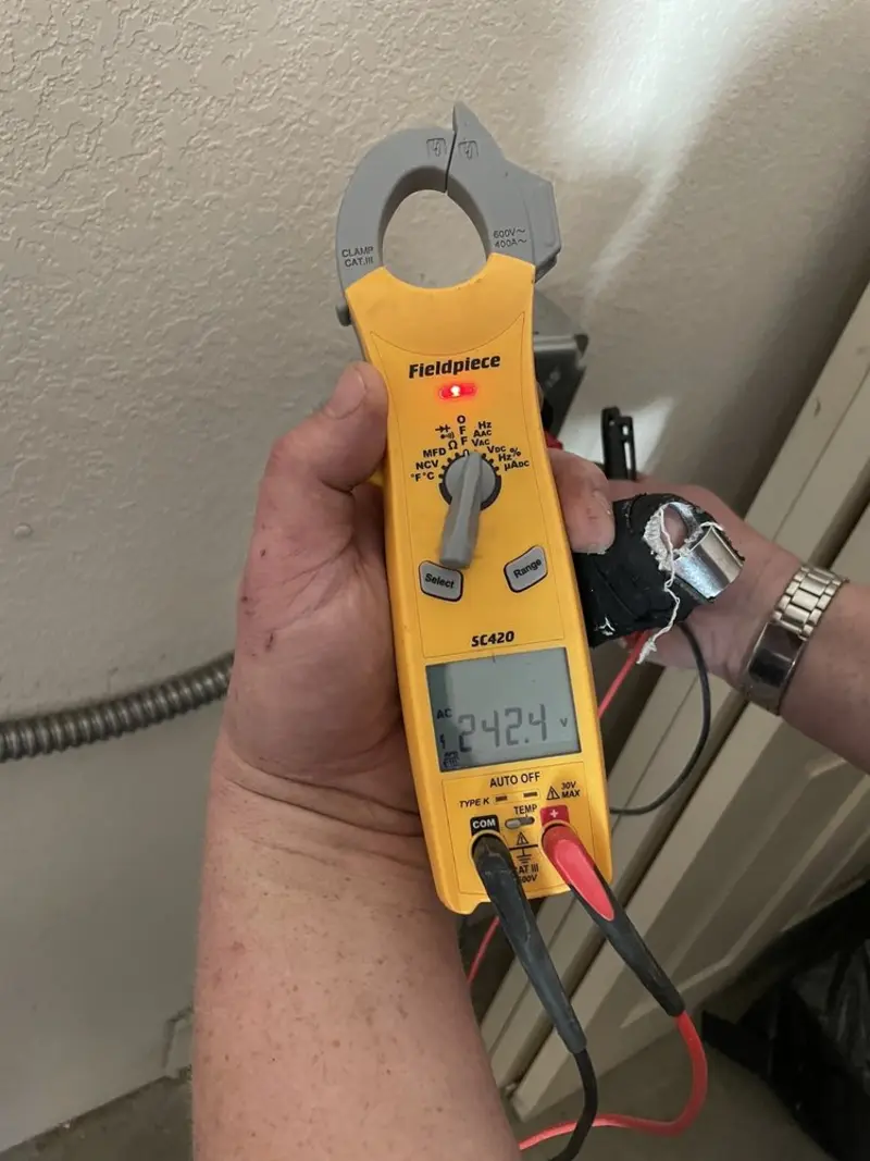 Voltage testing with clamp meter during Electrical Installation Services in Delray Beach